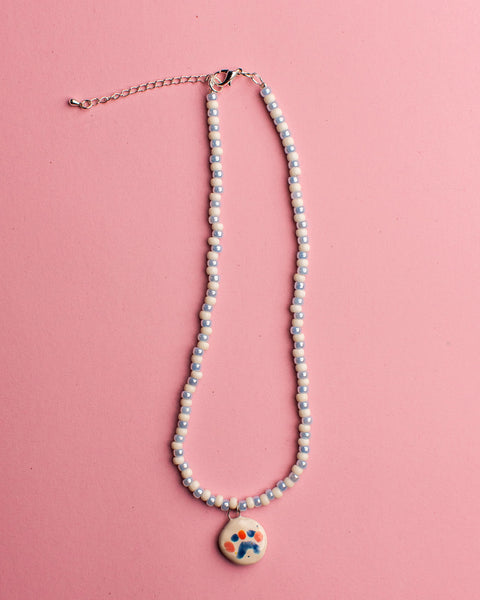 Pansy x Emily Green Ceramic Charm Necklace - White and Blue face